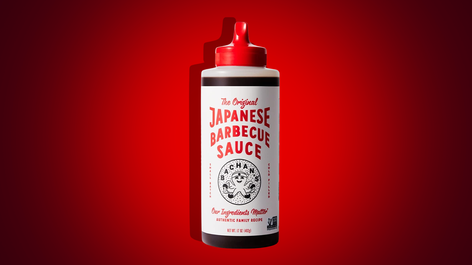 A bottle Bachan’s Japanese Barbecue Sauce against a red backdrop. Photo illustration.